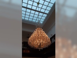 View of the interior of the villa with a large crystal chandelier