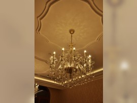 Luxury crystal chandelier in the old stone building